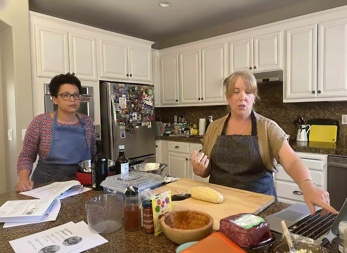 Veronique teaching students in a cooking workshop